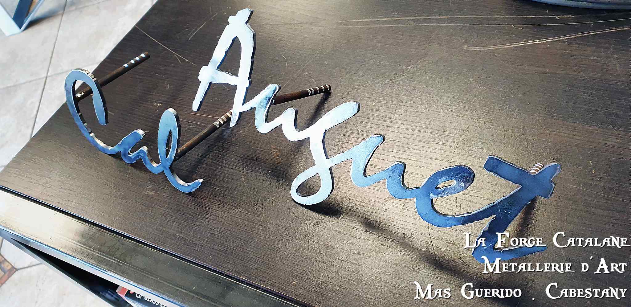 ecriture decoupe laser forge catalane.jpg